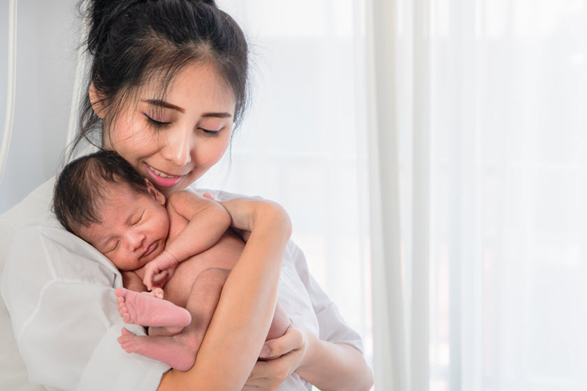 Image of Mother holding infant child